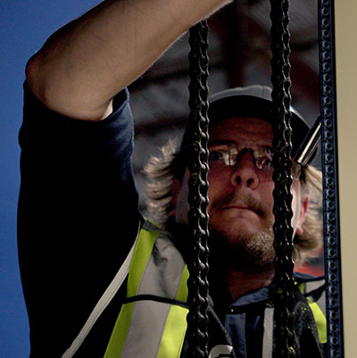 Cisco-Eagle technician working on vertical lift module