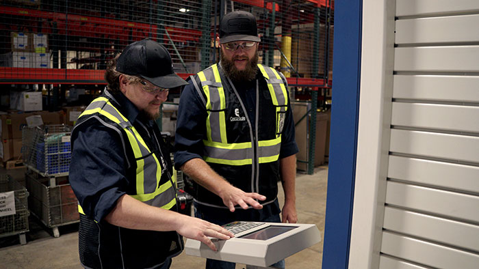 Certified Cisco-Eagle Technicians prepare to service a vertical lift module