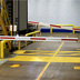 AisleCop gates guarding a forklift and pedestrian intersection