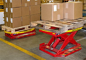 rotary scissor lift with cartons and a pallet load