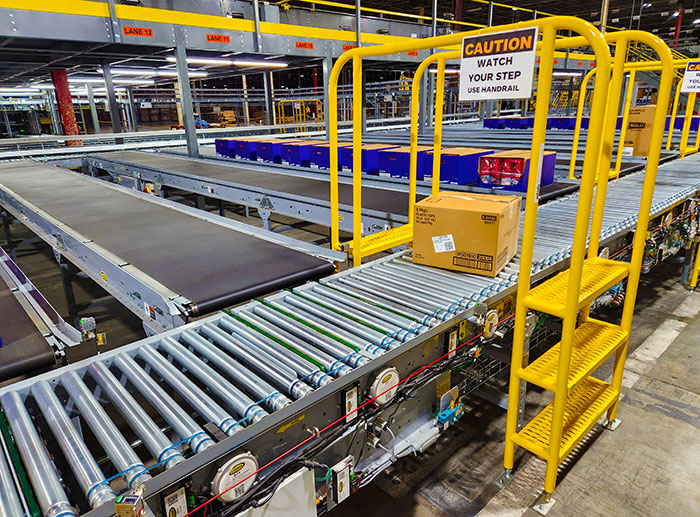 Output lines deliver cartons from the AS/RS system