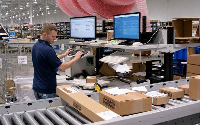 Packing station along the conveyor line at Mouser in Mansfield, Texas.