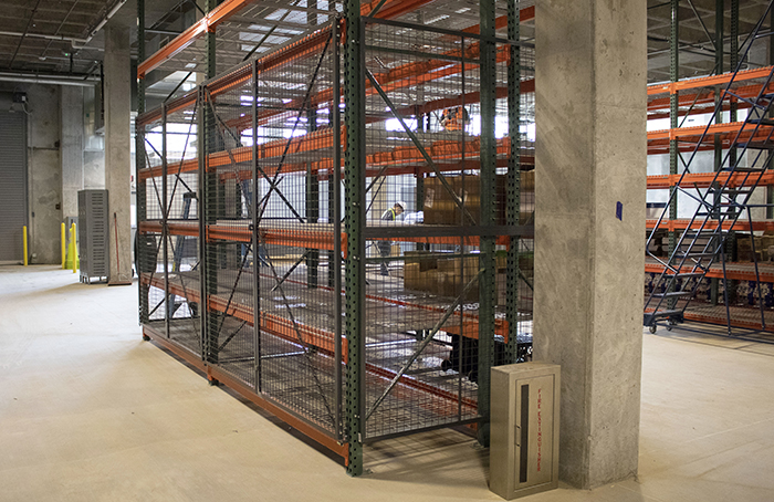 Secure pallet rack storage with wire cage surround