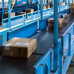 parcel conveyor system in an order fulfillment facility