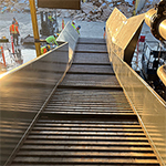 Heavy-Duty Incline Conveyor Feeds Recycling Operation 