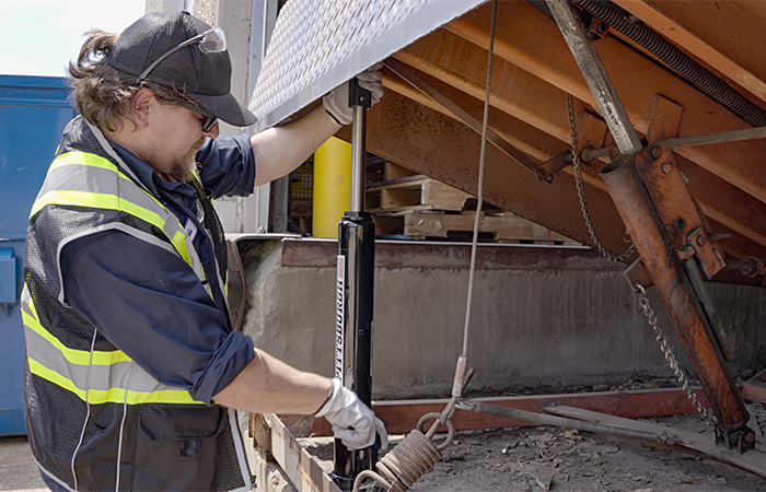 Cisco-Eagle employee-owner servicing a dock leveler